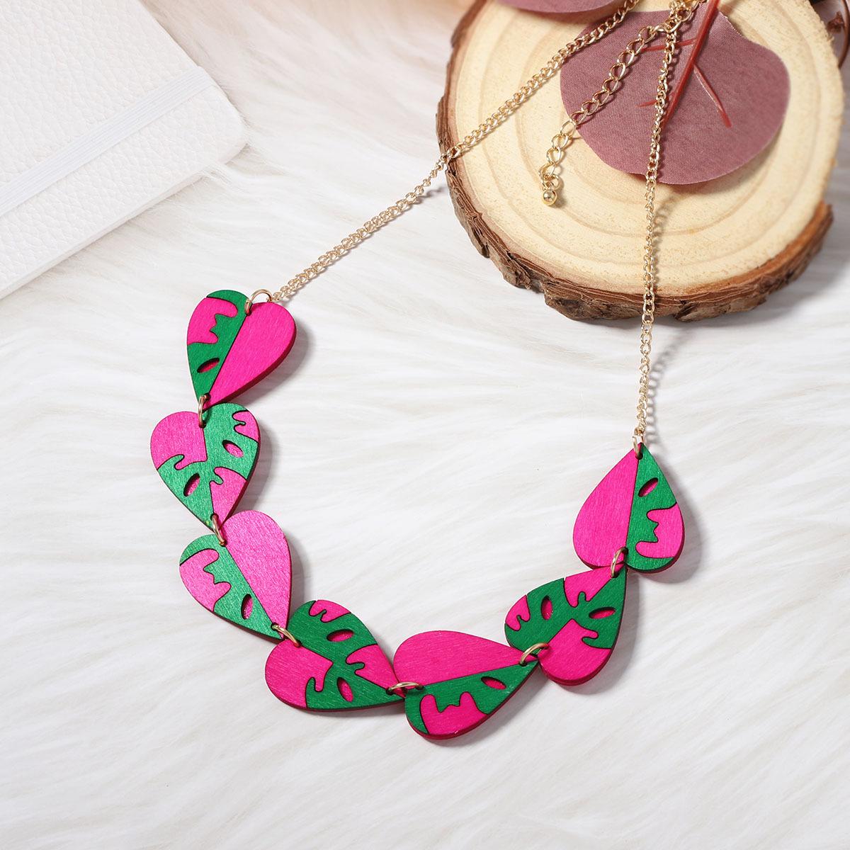 

A unique and creative design sense wooden cut and painted heart-to-heart imitation pearl earrings necklace for women