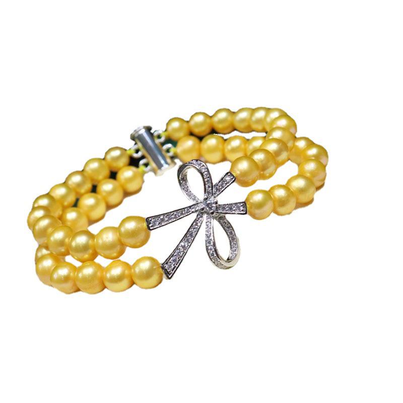 077 Freshwater Pearl Bracelet 7-8mm with Bow Design: Versatile, Elegant, High Luster Jewelry with Minor Flaws