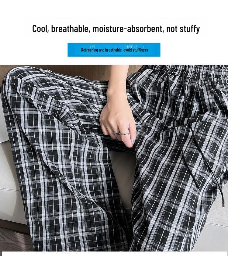 Dámské kalhoty s vysokým pasem, černo-bílé kostkované, se širokými nohavicemi a splývavým střihem