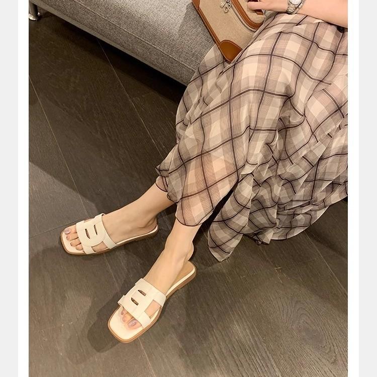 hollowed out and thin square head soft bottom versatile flat bottom one word beach wear leather slippers female summer