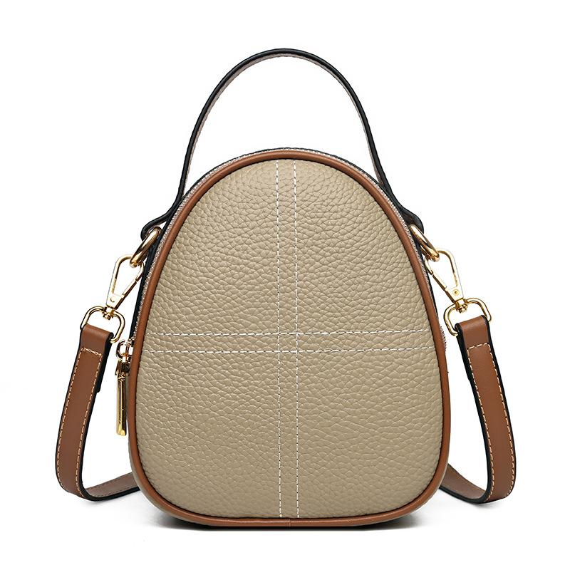 

Женская сумка из кожи Oblique Span, маленькая круглая сумка, модная и эффектная, сумка для мобильного телефона из коровьей кожи первого слоя, на одно плечо. светло-серый