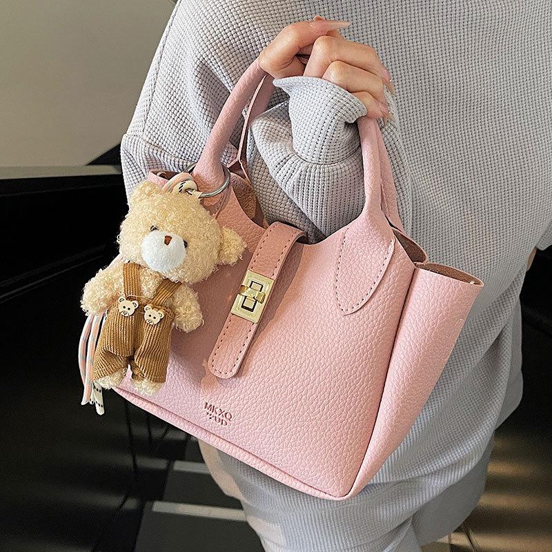 Wholesale hot sale simple temperament light luxury lychee pattern portable bucket bag niche design versatile commuter messenger bag