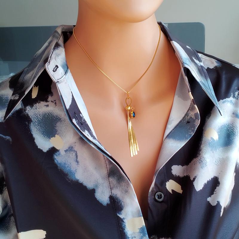 Chaîne de clavicule pendentif fluide en titane et acier doré