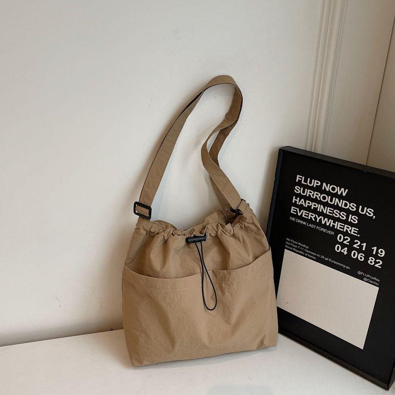 

Korean Series Ins Casual Canvas Bag Women Large Capacity Lightweight Bucket Bag Class Commuter Shoulder Messenger Bag Cloth Bag Khaki