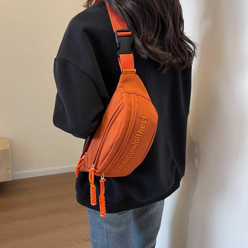 Versatile Water-resistant Canvas Crossbody Bag With Letter Print Perfect For Travel And Casual Use