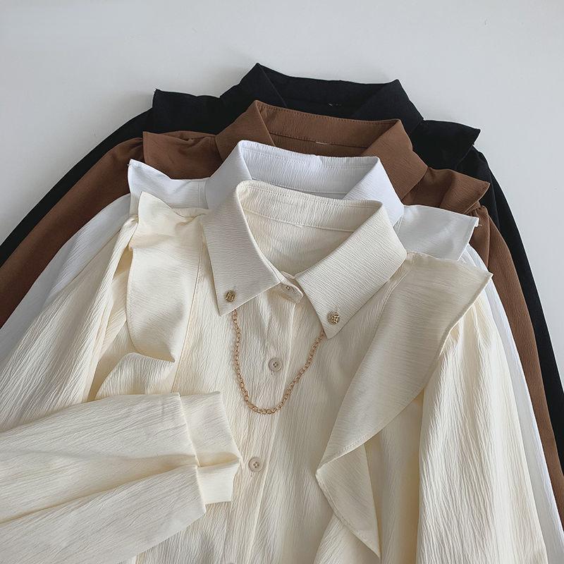 

Нишевый дизайн Сплошной цвет Рубашка Весна Осень Новый стиль Корейский темперамент Свободный Верх Цепочка Украшение Рубашка Элегантный Длинный рукав Пуговица Рубашка