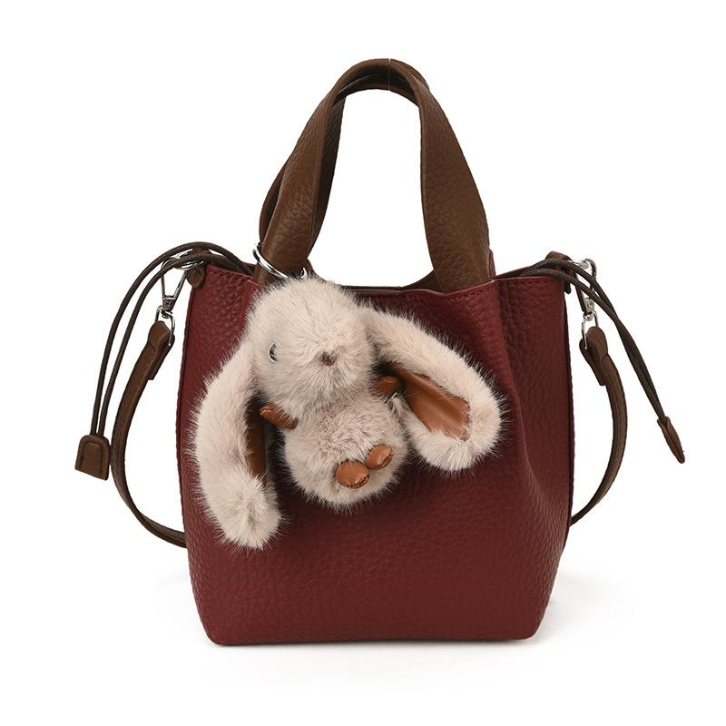 

Retro high-end handbag, versatile bucket bag, women s 2025 winter new Korean version, mother and child shoulder messenger bag no pendant