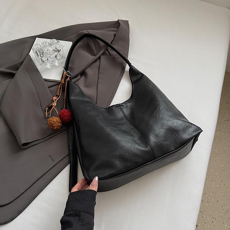 

Корейская версия женской сумки-ведра через плечо большой вместимости, новая осенняя тенденция 2025 года, корейская версия модной повседневной сумки-ведра под мышкой