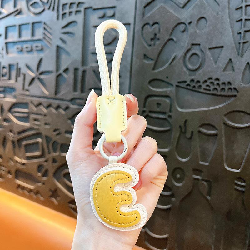 Kreativer Leder-englischer Alphabet-Schlüsselanhänger Dopamin-Taschenanhänger Schmuckzubehör Geschenk Autoschlüsselanhänger