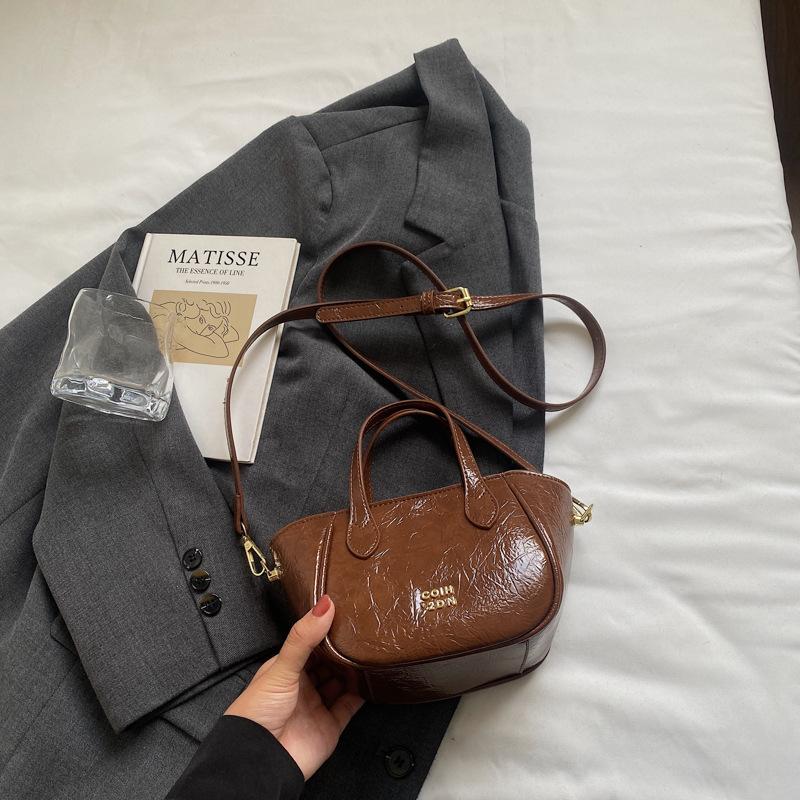 

Korean simple handbag niche foreign shoulder bag women s 2025 summer new high-value messenger bucket bag