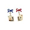 Asymmetrical Poker Rabbit Bowknot Earrings with Silver Needle Stud and No-Pierce Clip.