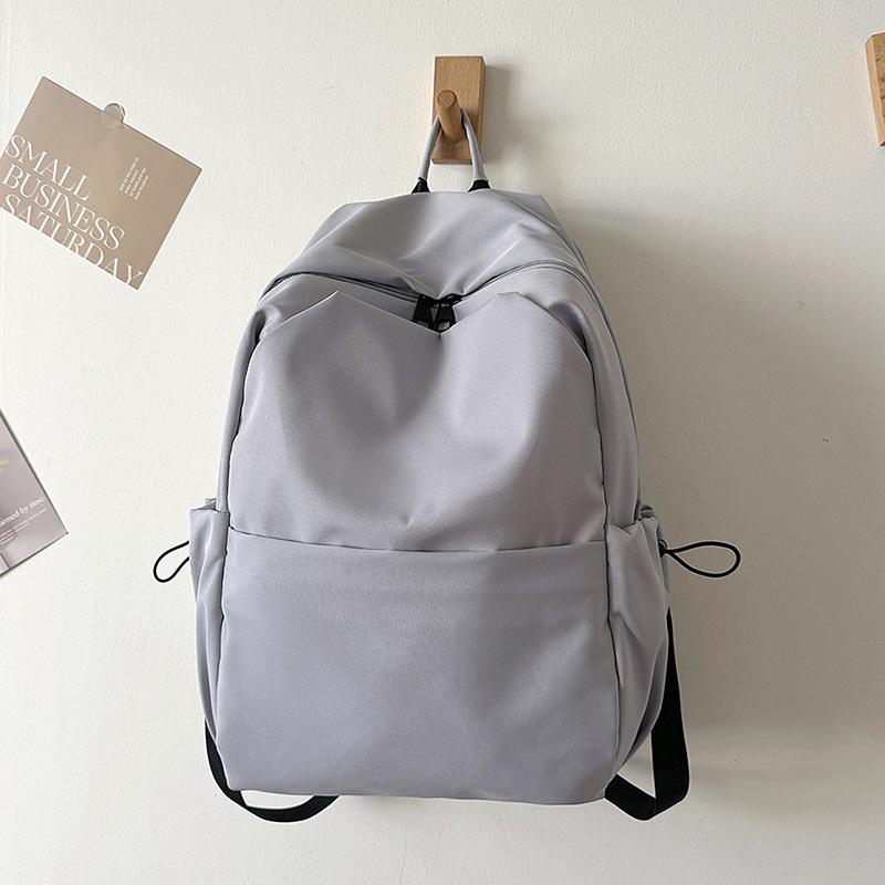 Schoolbag new versatile solid color large-capacity backpack women's schoolbag male college student junior high school student casual computer bag