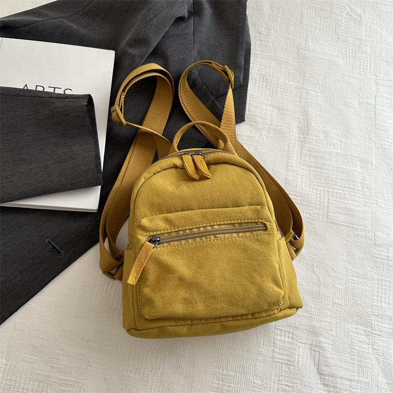 Einfacher lässiger Mini-Rucksack für Damen 2025 neue modische einfarbige kleine Tasche klein frisch Studenten-Reiserucksack
