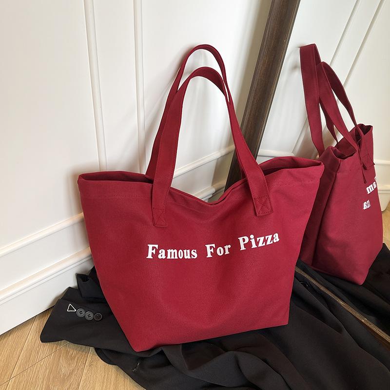 

Niche red canvas bag new casual letter printing canvas shoulder bag large capacity student bag красный