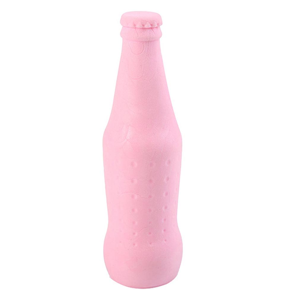 dog chewing plastic bottle