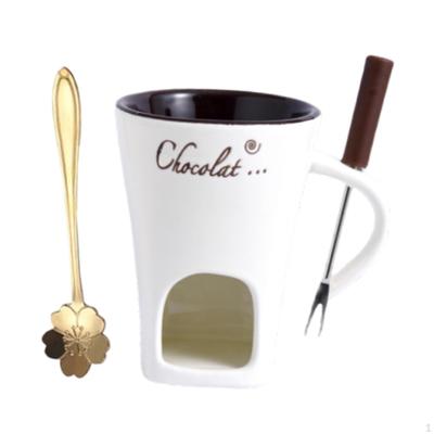 Čokoládové fondue pohár s vidličkou a lyžičkou na rozpúšťanie syra, vývaru, masla, ohrievač