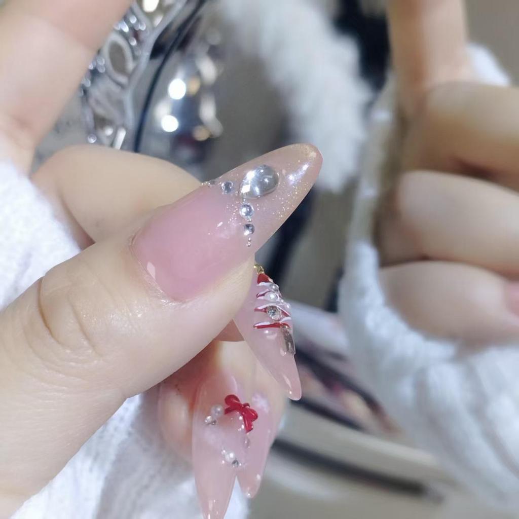 Elegant Handmade Long Cat Eye Christmas Nails with Snowflakes and Rhinestones