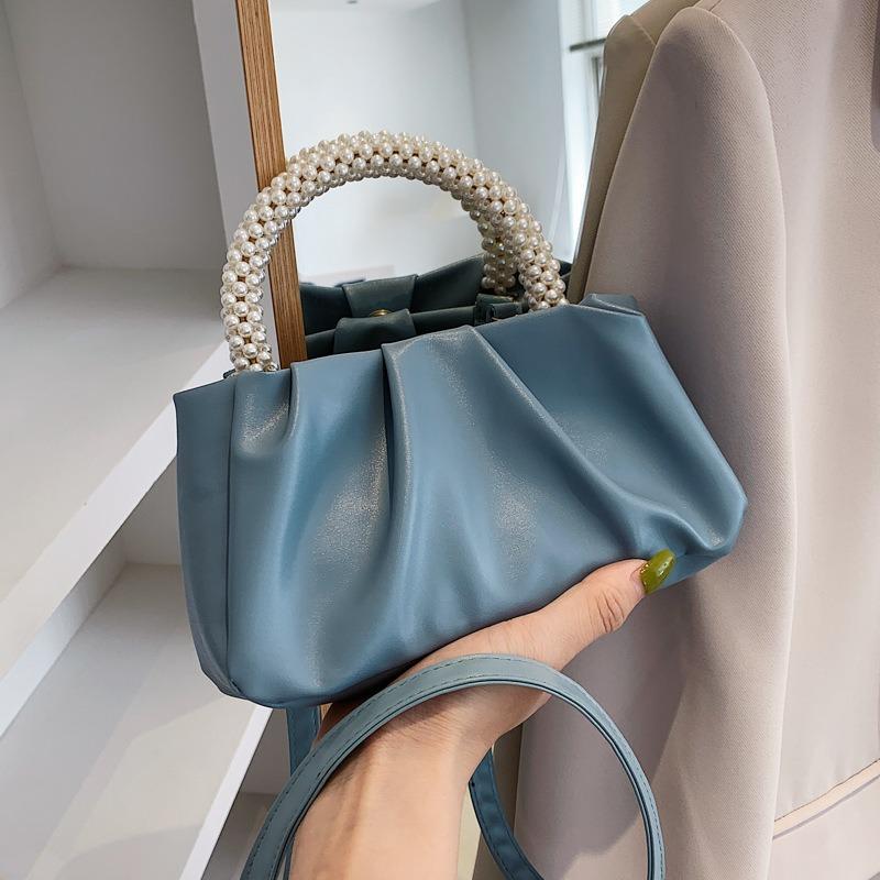 Solid color women's bag, summer new cloud bag, fashionable softfaced portable small bag, simple foreign style single shoulder oblique span bag