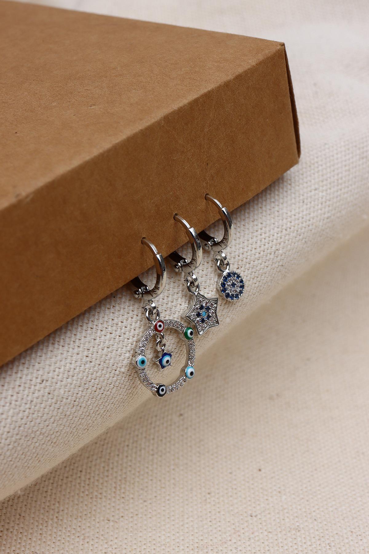 

Серьги серебряного цвета с изображением сглаза из трех частей