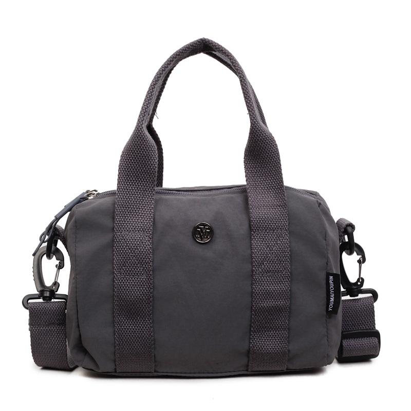 

New fashion niche design women s casual tote bag large capacity commuting simple solid color one shoulder crossbody bag сірий колір