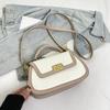 Spring niche design fashionable contrasting color saddle bag portable shoulder crossbody trendy women's bag