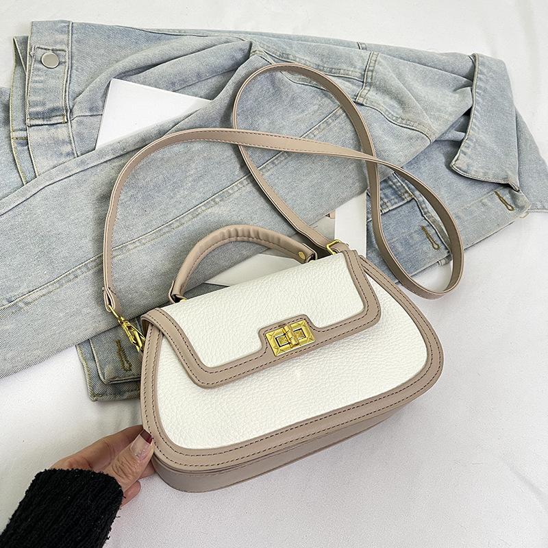 Spring niche design fashionable contrasting color saddle bag portable shoulder crossbody trendy women's bag