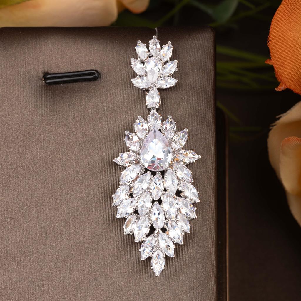 A pair of luxurious inlaid cubic zirconia marquise-shaped dangling hollow earrings suitable for women's everyday and party wear