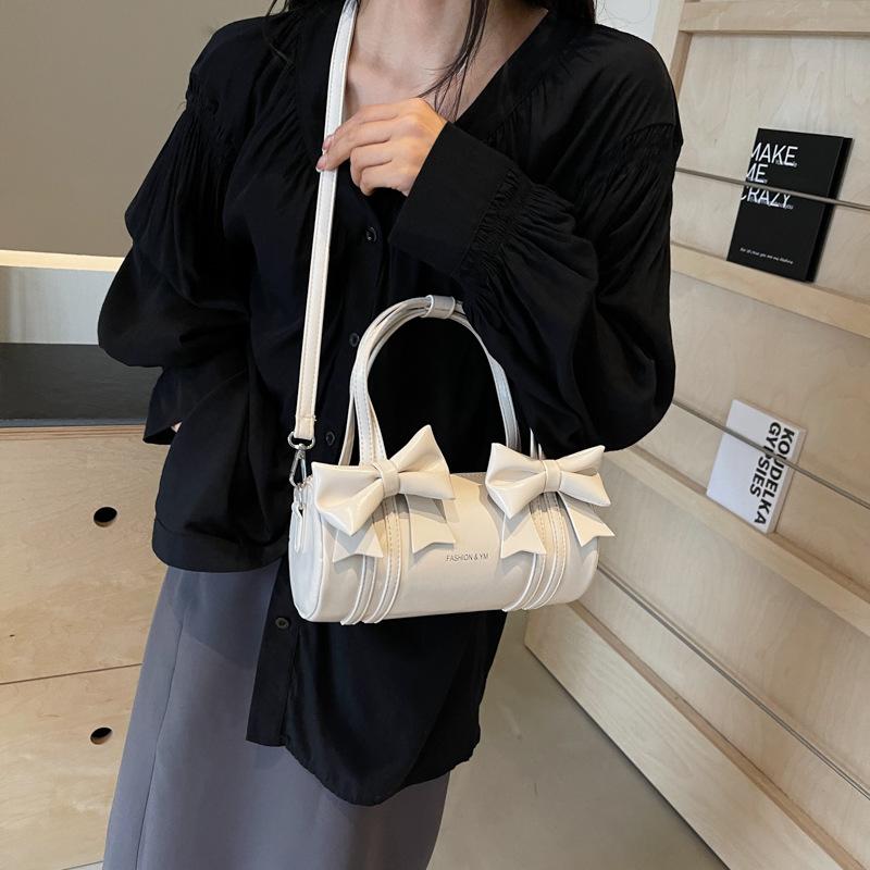 

Сумка подмышкой женская 2024 новый модный дизайн sense нишевая сумка-мессенджер балетный стиль бант портативная цилиндрическая сумка бежевый