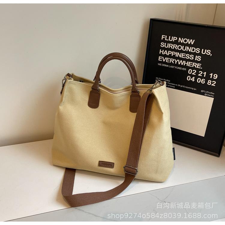 

Casual simple tote bag large capacity women s bag 2025 new commuter messenger bag fashionable women s shoulder canvas bag