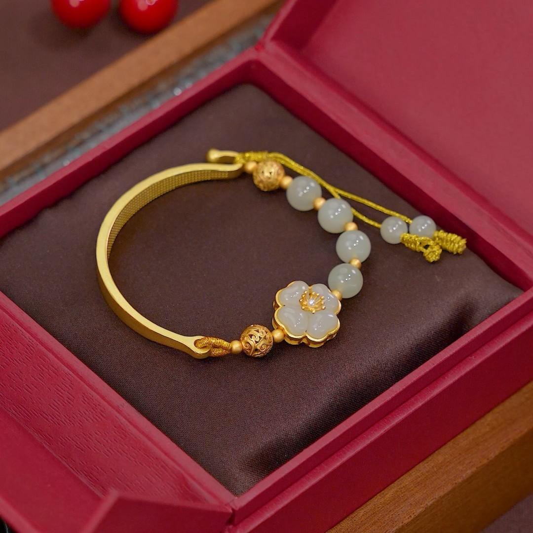 

The designer recommends the Flowers Blooming Ten Miles Hetian Jade Fortune Bead Bracelet, a vintage bracelet with a sweet, ancient-style Flowers blooming for ten