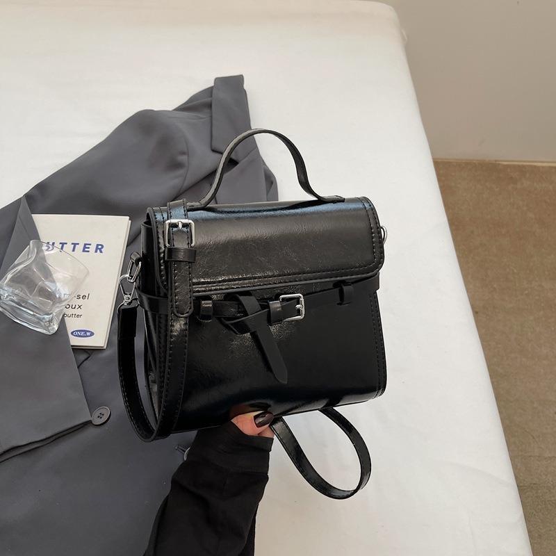 Trend niche high-end sense solid color versatile portable small square bag women's commuting simple oil wax leather messenger bag