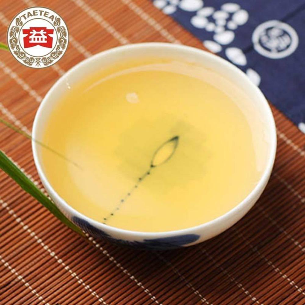 150g TAETEA 7542 Syrový koláč Puer Dayi Menghai Sheng Pu-erh
