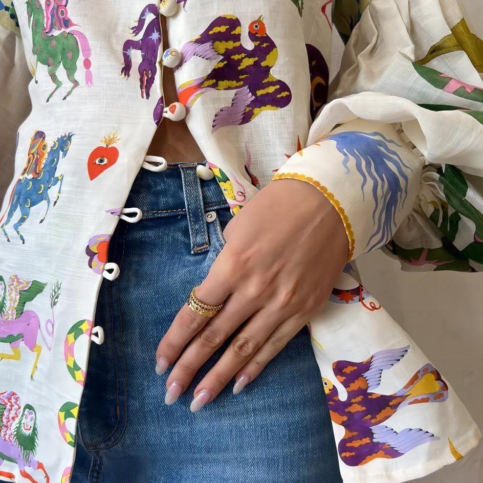 QICED Mode Persönlichkeit Graffiti-Print Revers Laternenärmel Strickjacke Hemd