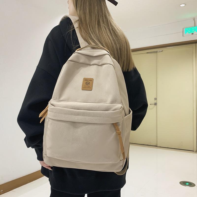 Japanese solid color backpack female Korean version Harajuku simple high school student backpack campus junior high school student couple schoolbag
