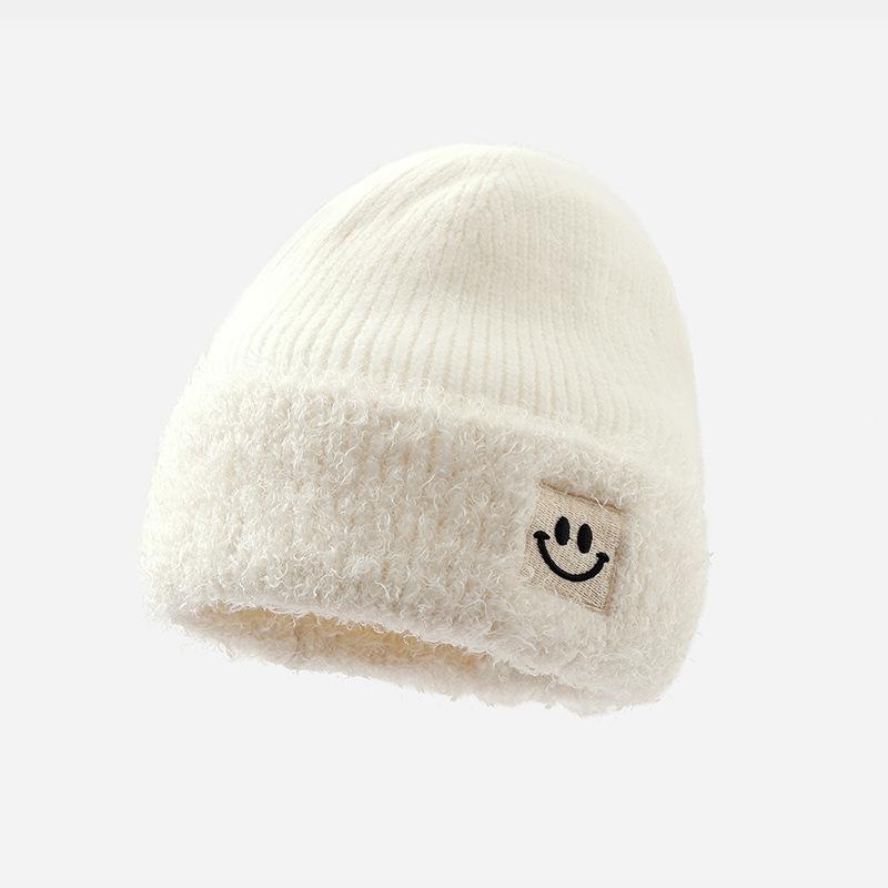 

Корейская версия новой осенне-зимней шапки для женщин, милая вязаная шапка из шерсти с улыбающимся лицом, зимняя ветрозащитная и теплая студенческая плюшевая шапка, тренд One Size