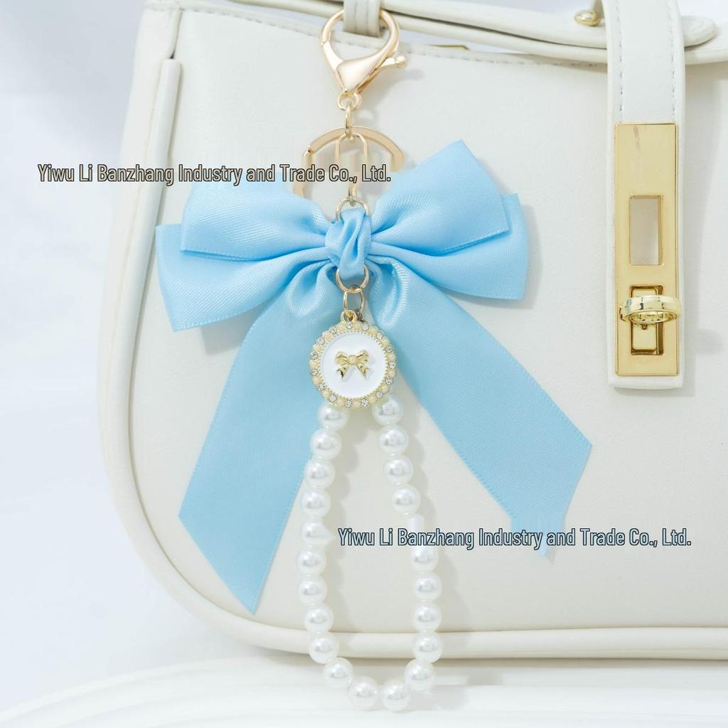 Large Bow Faux Pearl Bracelet Keychain with Colored Woven Strap and Alloy Tag Pendant