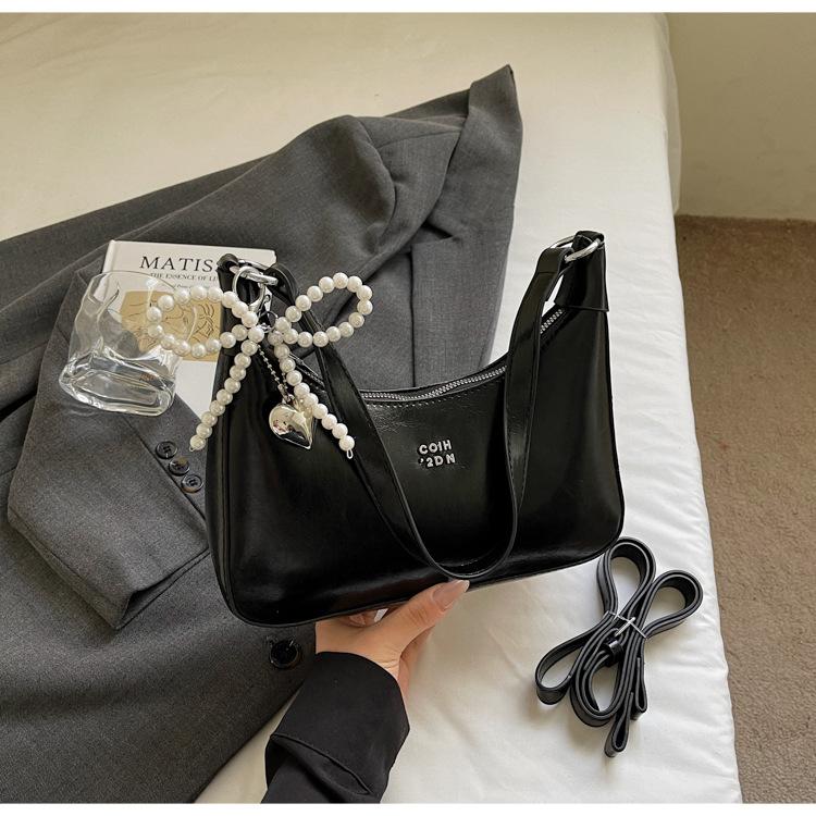 

Премиальная текстура нишевая сумка подмышку женская 2025 новая трендовая летняя в иностранном стиле универсальная сумка через плечо сумка-пельмень сумка-мессенджер