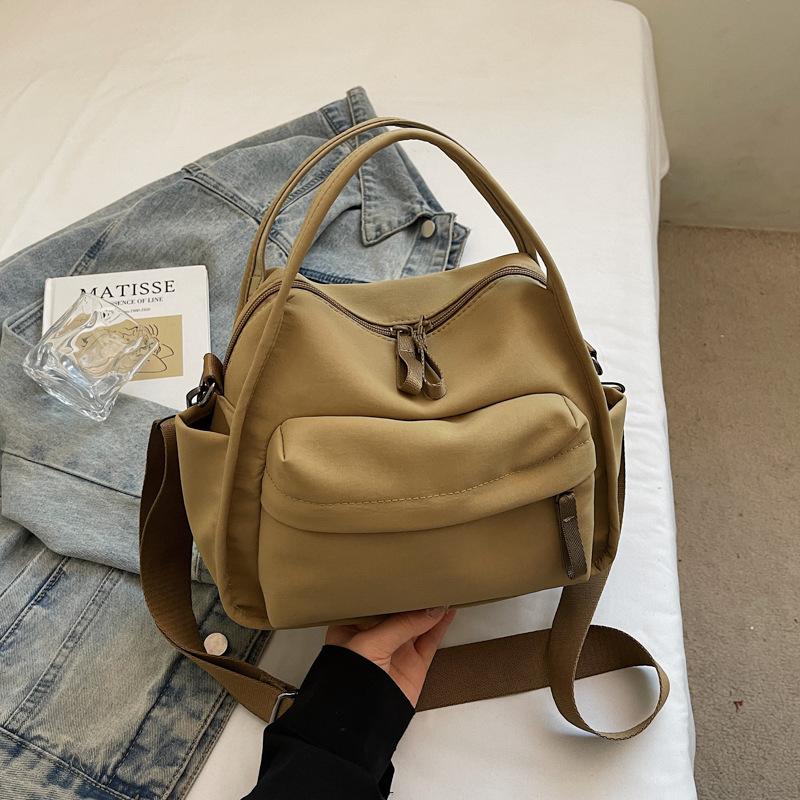 

New simple and lightweight casual bag stylish and simple Oxford cloth women s messenger bag shoulder portable commuter bag хаки
