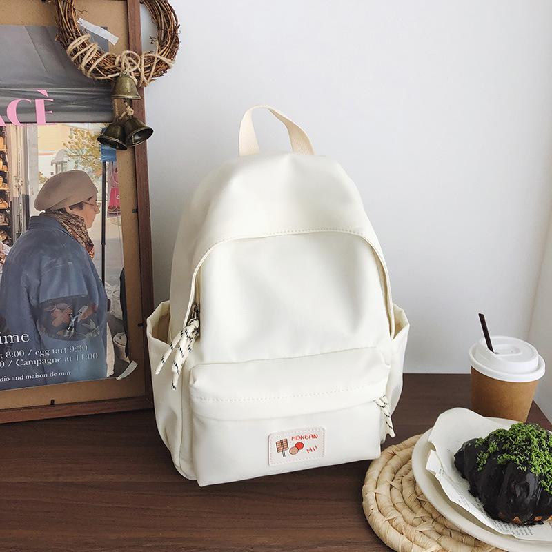 New casual simple solid color backpack large capacity junior high school student schoolbag
