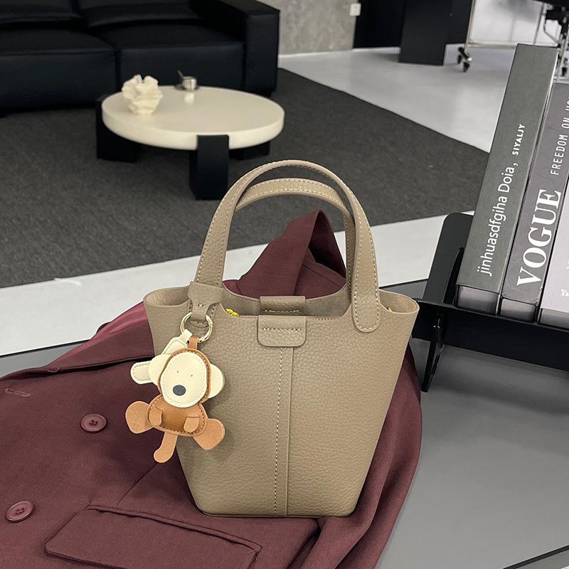 

Bags Women s new niche messenger bags Premium bucket bags Leather vegetable baskets Portable shoulder bags