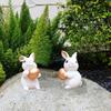 2 estatuas de conejo de Pascua con forma de huevo, de resina, para decoración del hogar.
