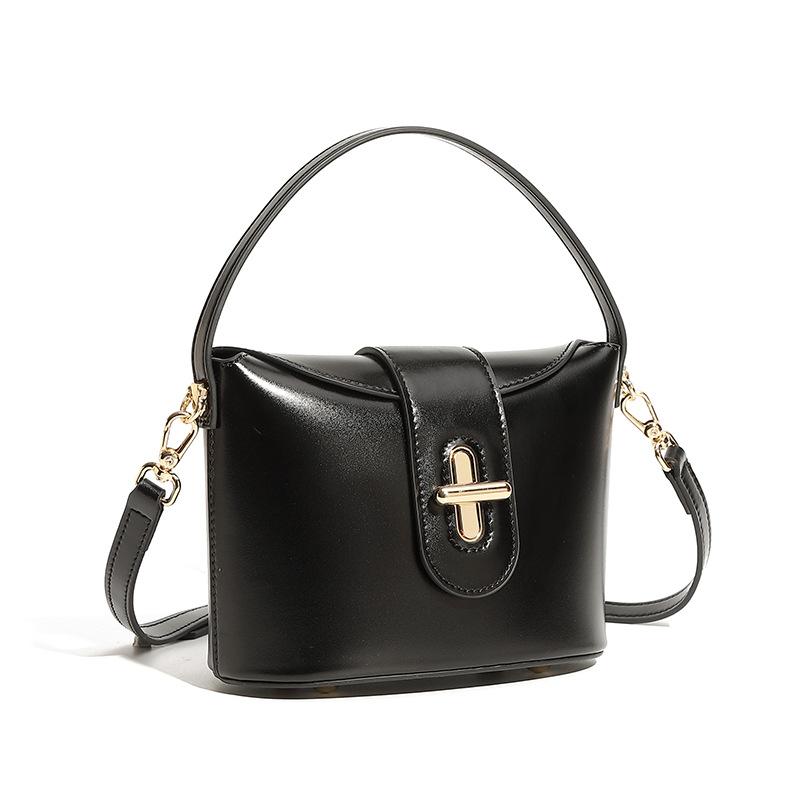 

Новая трендовая городская простая женская сумка из натуральной кожи, сумка через плечо, женская сумка, легкая роскошная нишевая сумка высокого класса с капсульным замком 17*9*14