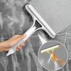 A Household Glass Cleaning Scraper That Combines The Functions Of A Watering Can And A Window Scraper