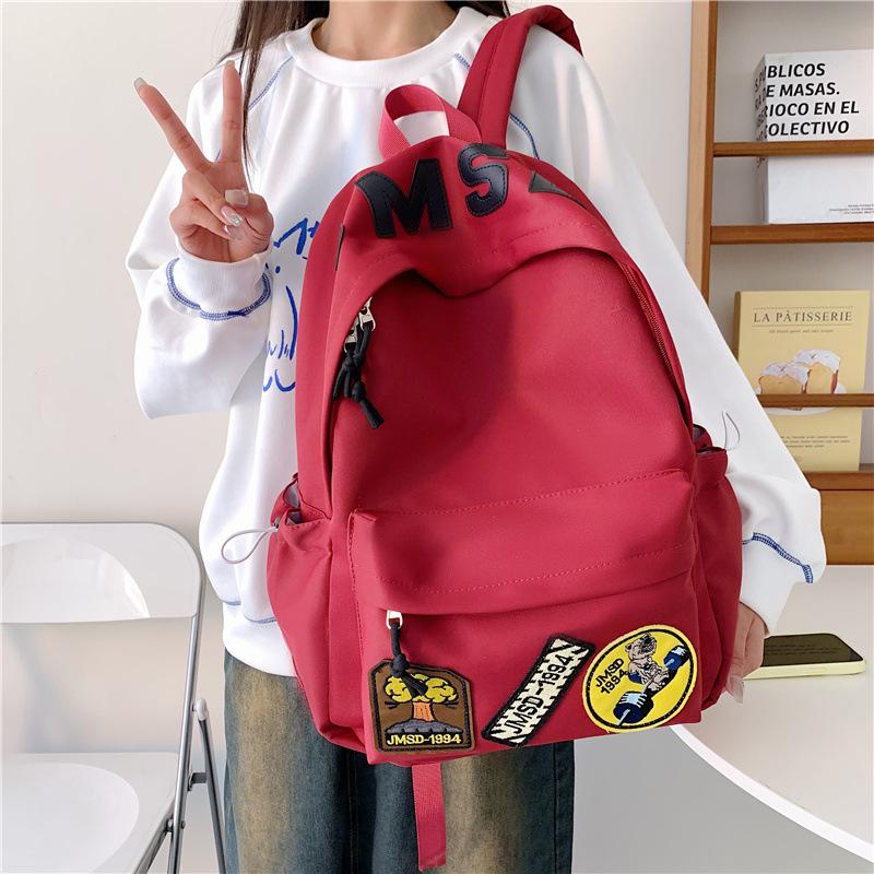 New high-value backpack, junior high school student schoolbag, women's leisure, light commuting, going out for travel, large-capacity backpack.