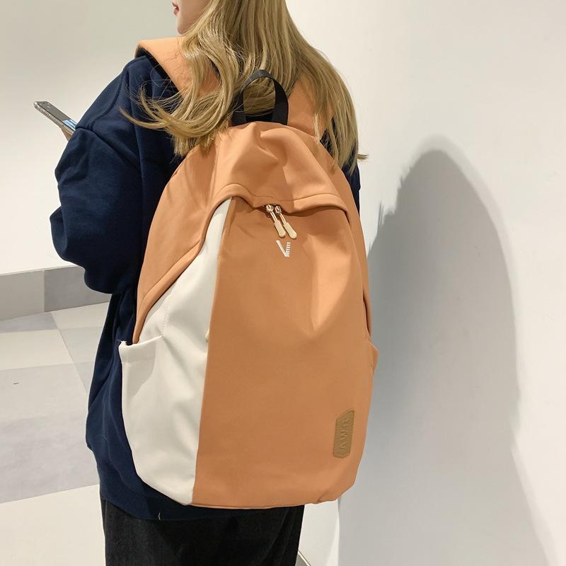 A Male College Student with A Small Simple Large-capacity Computer Backpack