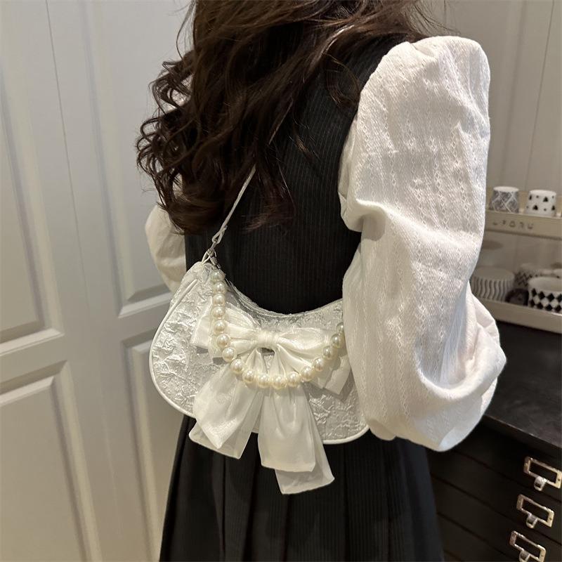 Popular design pearl handbag bag women's summer new messenger bag bow shoulder armpit bag