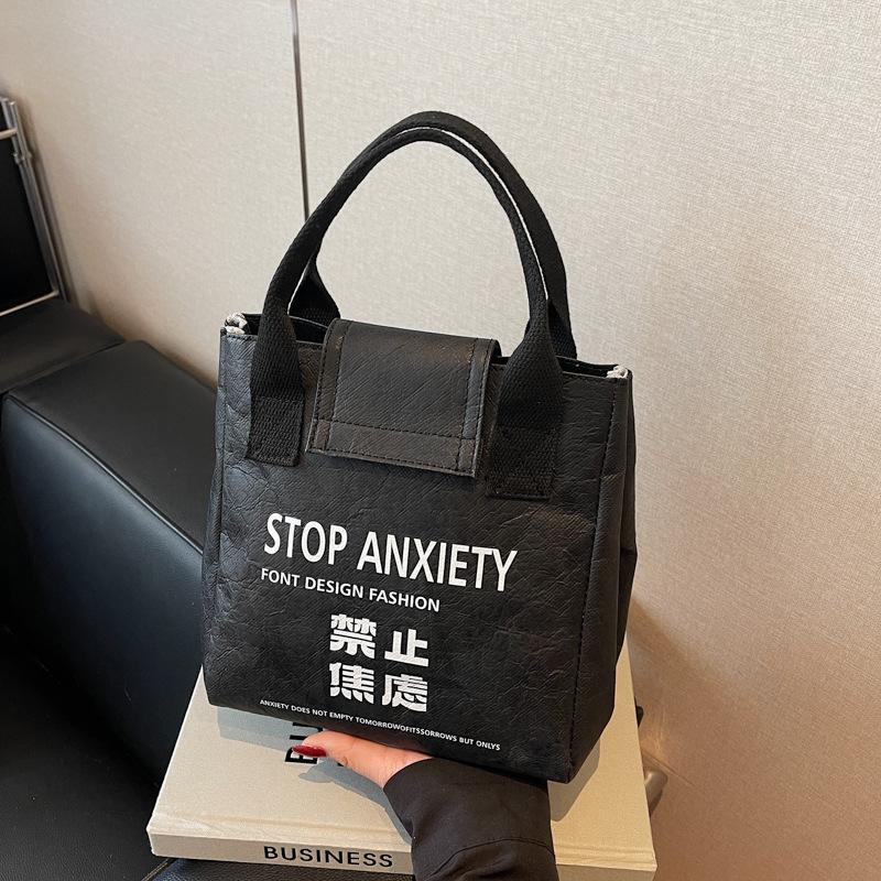 

Summer high-end commuter niche handbag women s new casual versatile DuPont paper bucket bag чёрный