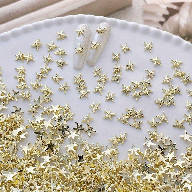 Goldene Seestern-Nagelanhänger Meeresstil Glitzernde Strasssteine Stern-Nagelkunst-Dekorationen Frühling Sommer 10 Stück 3D-Legierung DIY-Nagelsteine Geschenk für Mädchen