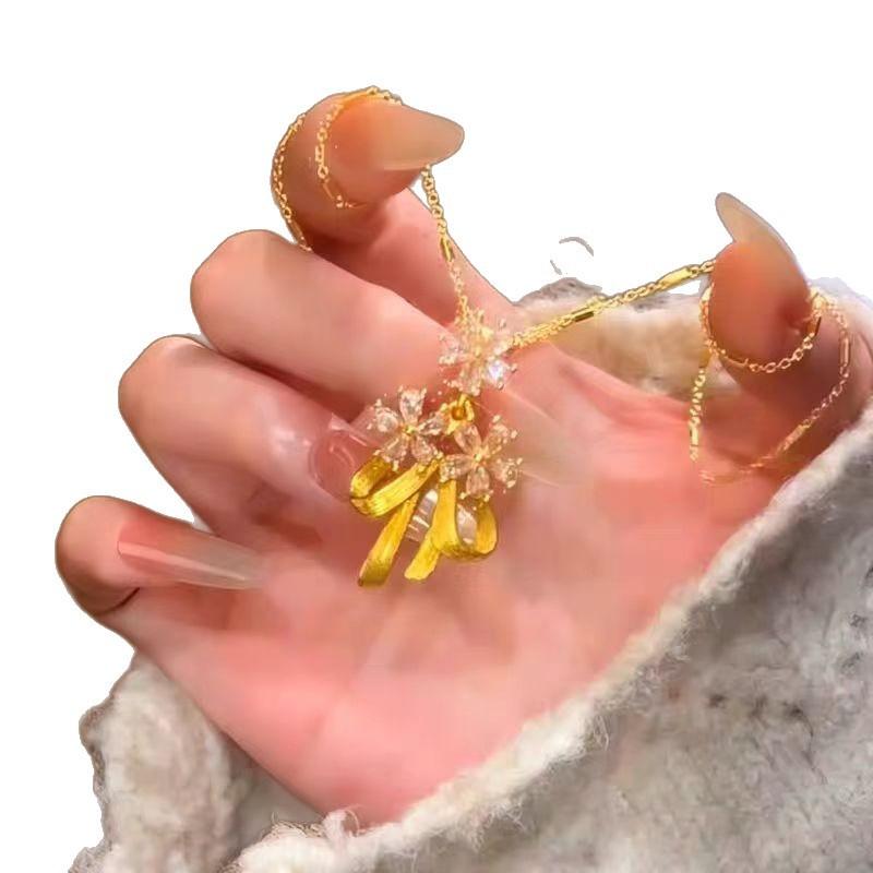 New Chinese bow flower pendant fringed necklace women's gold high-end temperament niche design accessories