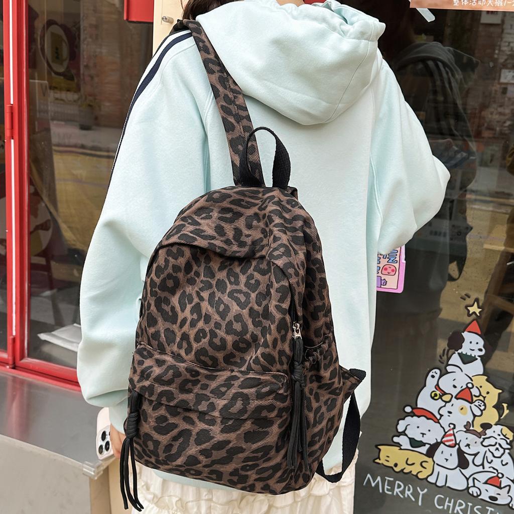 Leopard Print Backpack Casual Daily Use Trendy Street Style Lightweight Backpack for Women with Tassel Detail for School Travel and Everyday Outings